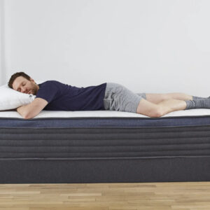 Man sleeping comfortably on a mattress