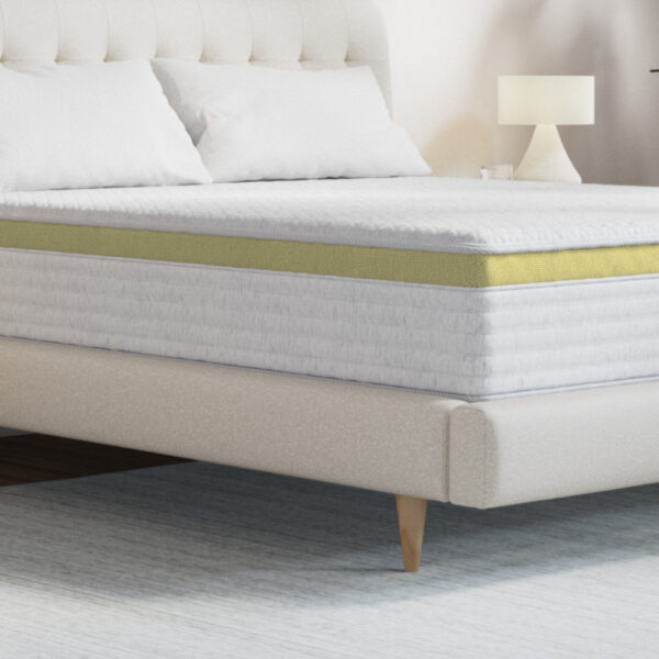 Modern mattress on stylish bed with lamp