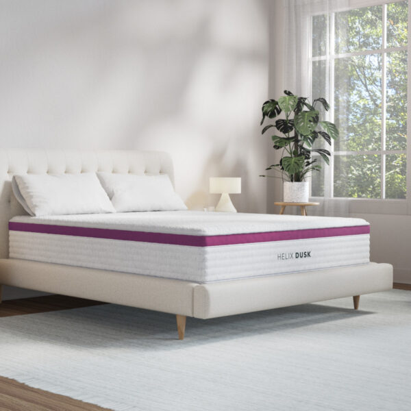 Elegant bedroom with modern mattress and decor.