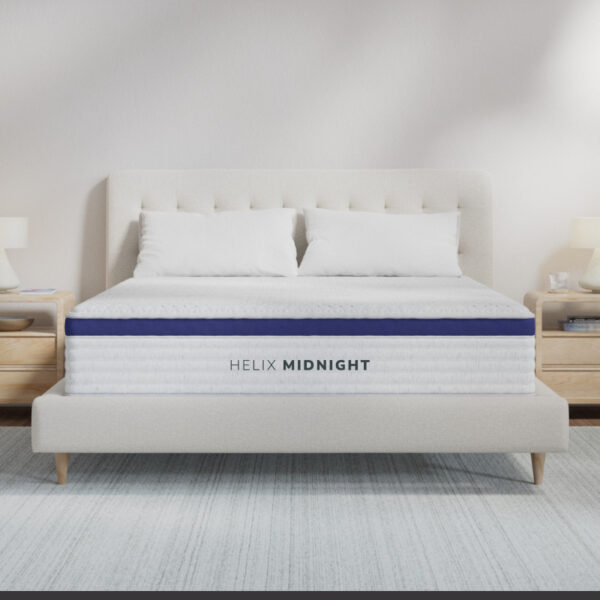Comfortable mattress on a modern bed frame.