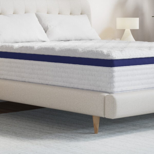 Contemporary bed with white bedding and wooden legs.
