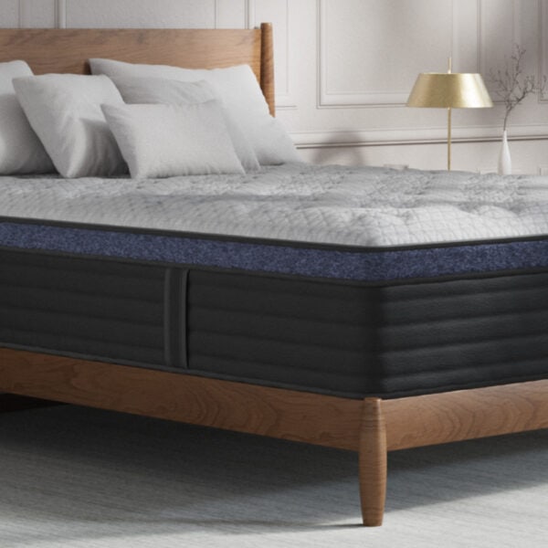 Comfortable luxury mattress on wooden bed frame.