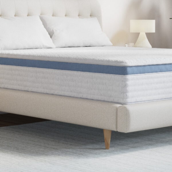 Modern bed with white mattress and pillows.