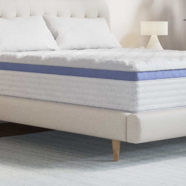 Luxurious bed with plush mattress and pillows.