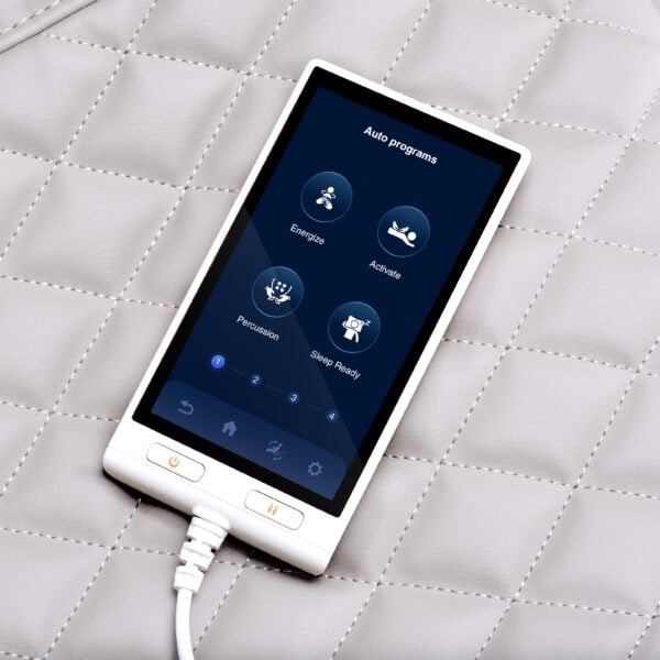 Electronic device screen showing auto programs on quilted fabric.